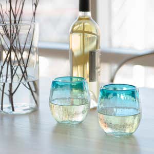 https://www.vivaterra.com/images/491581401-Maya-Recycled-Stemless-Wine-Glass-Set-of-2-Aquamarine_lifestyle02x300.jpg?format=300Wx300H